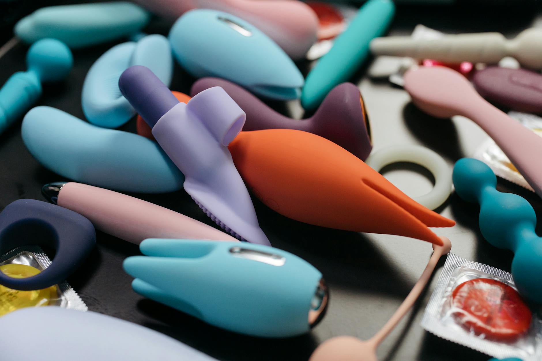A woman holding a lemon vibrator with art books nearby, exploring pleasure and connection